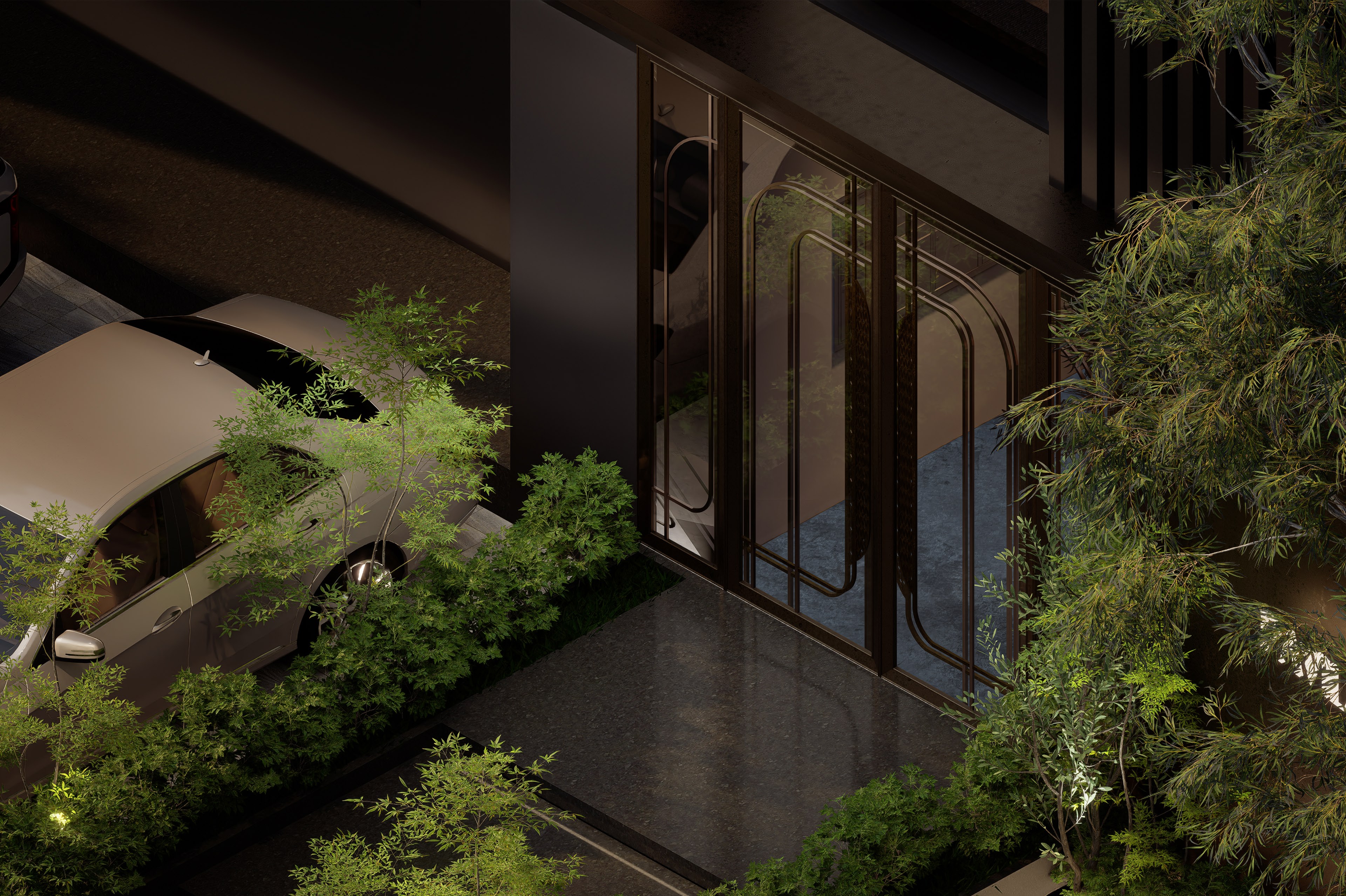 The entrance from above at night, brass doors lit